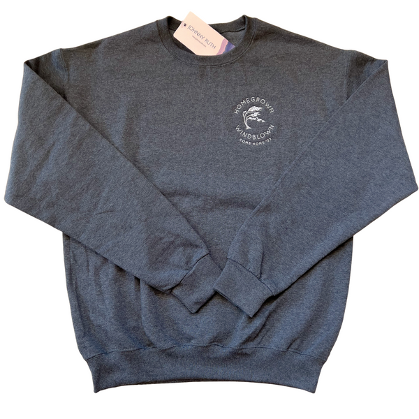 Dark grey unisex sweatshirt with a white, round ,"Homegrown Windblown" logo surrounding an embroidered Tuckamore tree with the words Come Home '22 underneath, in the top right corner of the sweatshirt. 